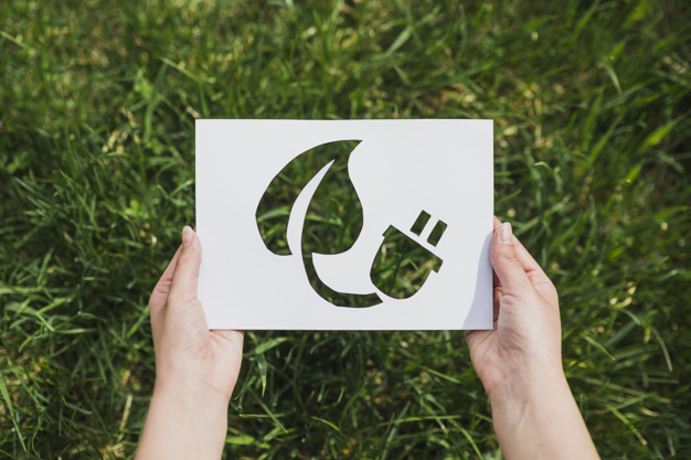 eco-concept-with-hands-holding-cut-out-paper-showing-eco-energy_23-2147807296
